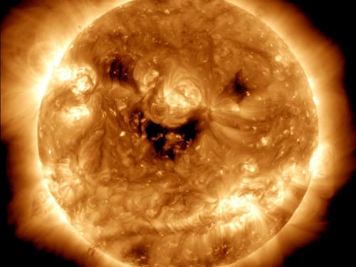 Smiley face in the sun photos from Solar Dynamics Observatory